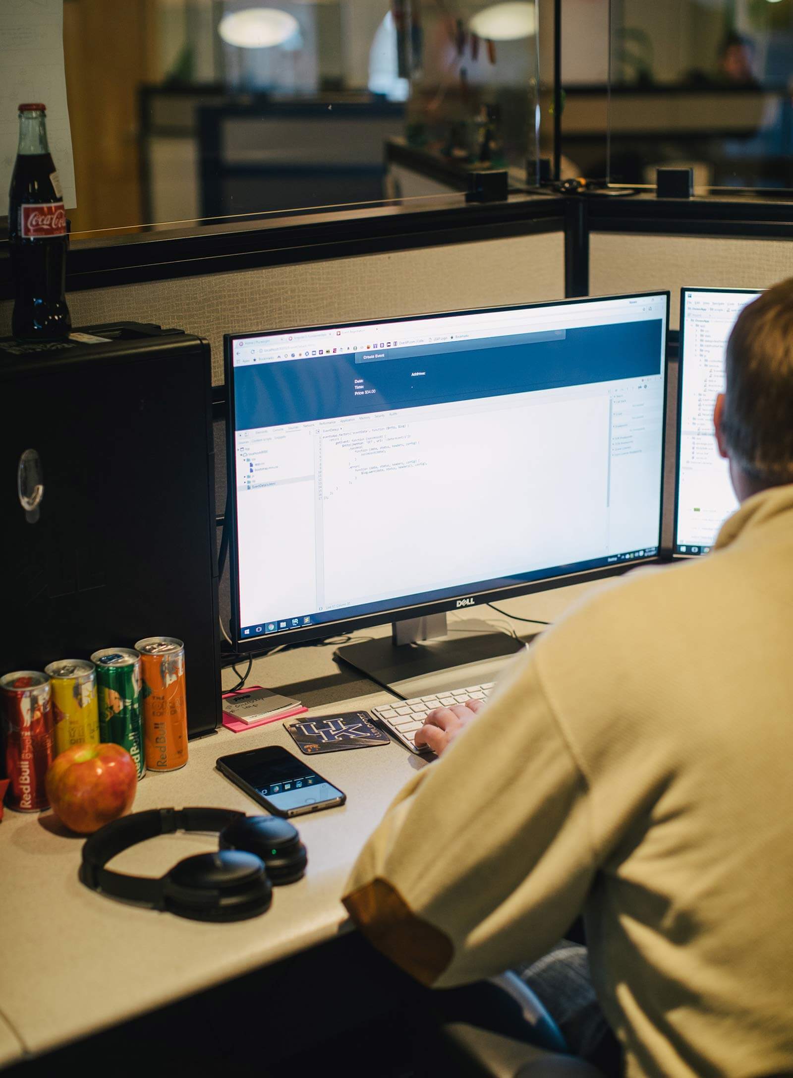 man working at computer workstation